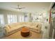 Spacious living room with an open concept flowing into the updated kitchen featuring an eat-in island at 10323 Hardy Falls St, Las Vegas, NV 89141