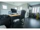 Home office featuring a desk, ample storage, and natural light from multiple windows at 10323 Hardy Falls St, Las Vegas, NV 89141