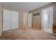 This carpeted bedroom includes a view to another carpeted bedroom at 10478 Beallsville St, Las Vegas, NV 89141