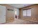 Cozy carpeted bedroom with a bathroom across the hall and a window for natural lighting at 10478 Beallsville St, Las Vegas, NV 89141
