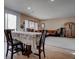 Dining area featuring a table with floral tablecloth, wood floors and view to the living room at 10478 Beallsville St, Las Vegas, NV 89141