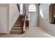 Entryway with staircase, high ceilings and large window for natural light at 10478 Beallsville St, Las Vegas, NV 89141