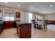 Open kitchen featuring an island with a granite countertop and wood flooring at 10478 Beallsville St, Las Vegas, NV 89141