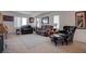 Inviting living room with carpet flooring, plush seating and natural light at 10478 Beallsville St, Las Vegas, NV 89141