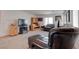 Comfortable living room with leather furniture and natural light from the window at 10478 Beallsville St, Las Vegas, NV 89141