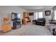 Neutral toned living area with a flat screen TV and traditional style cabinets at 10478 Beallsville St, Las Vegas, NV 89141
