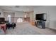 Upstairs loft area with leather seating and TV, carpet throughout at 10478 Beallsville St, Las Vegas, NV 89141