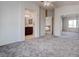 Spacious main bedroom featuring neutral carpet, ceiling fan, walk-in closet and access to the main bathroom at 10478 Beallsville St, Las Vegas, NV 89141