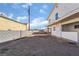 Expansive, graveled backyard area enclosed by a block wall, presenting a blank canvas at 116 W Victory Rd, Henderson, NV 89015