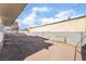 Spacious graveled backyard enclosed with a block wall, providing opportunity for outdoor enjoyment at 116 W Victory Rd, Henderson, NV 89015