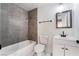 Modern bathroom with gray tiled shower, white vanity, and a square mirror at 116 W Victory Rd, Henderson, NV 89015