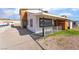 Charming two-story home featuring a wood-clad facade and desert landscaping at 116 W Victory Rd, Henderson, NV 89015