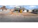 Charming two-story home featuring a wood-clad facade and desert landscaping at 116 W Victory Rd, Henderson, NV 89015