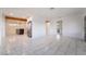 Bright, spacious living room features white walls and marble-style tile flooring at 116 W Victory Rd, Henderson, NV 89015