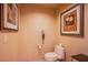 Cozy powder room features a modern toilet, neutral decor, and clean design at 125 E Harmon Ave # 2801&2803, Las Vegas, NV 89109