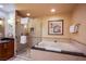 Bathroom featuring a soaking tub and glass-enclosed shower at 125 E Harmon Ave # 2801&2803, Las Vegas, NV 89109