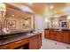 Stylish bathroom features dual vanities, granite countertops, and large mirrors for a luxurious feel at 125 E Harmon Ave # 2801&2803, Las Vegas, NV 89109