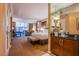 This bedroom suite features a desk, sitting area, king bed, bench and a dry bar at 125 E Harmon Ave # 2801&2803, Las Vegas, NV 89109
