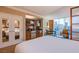 Hotel bedroom boasts kitchenette, seating area, and city views at 125 E Harmon Ave # 2801&2803, Las Vegas, NV 89109