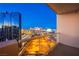 Expansive city view from a modern balcony with glass railings showcasing the vibrant cityscape at 125 E Harmon Ave # 2801&2803, Las Vegas, NV 89109