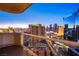 Breathtaking city skyline view at dusk from a high-rise balcony with glass railing at 125 E Harmon Ave # 2801&2803, Las Vegas, NV 89109