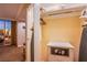 Walk-in closet with custom shelving, hanging rods, and a built-in safe for secure storage at 125 E Harmon Ave # 2801&2803, Las Vegas, NV 89109