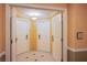 Hotel hallway featuring neutral colors and a decorative light fixture at 125 E Harmon Ave # 2801&2803, Las Vegas, NV 89109