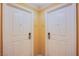Hotel hallway with two white suite doors at 125 E Harmon Ave # 2801&2803, Las Vegas, NV 89109