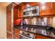 Updated kitchen features stainless steel appliances, granite countertops, and ample storage space at 125 E Harmon Ave # 2801&2803, Las Vegas, NV 89109