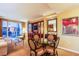 Open-concept living and dining area with a balcony view and a built-in entertainment center at 125 E Harmon Ave # 2801&2803, Las Vegas, NV 89109
