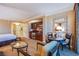 Hotel living room with a kitchenette, dining table, seating area, and bedroom views at 125 E Harmon Ave # 2801&2803, Las Vegas, NV 89109