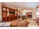 Spacious living area with a built-in entertainment center, dining table, and comfortable seating at 125 E Harmon Ave # 2801&2803, Las Vegas, NV 89109