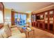 Comfortable living room with a sofa, balcony access, and a built-in entertainment unit at 125 E Harmon Ave # 2801&2803, Las Vegas, NV 89109