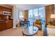 Hotel living room area features a dining area, kitchenette, and city views at 125 E Harmon Ave # 2801&2803, Las Vegas, NV 89109