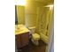 Bathroom features a vanity and a shower-tub combination with glass doors at 1341 Cinder Rock Dr # 101, Las Vegas, NV 89128
