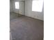 Spacious bedroom with plush carpeting and a mirrored closet at 1341 Cinder Rock Dr # 101, Las Vegas, NV 89128