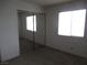 Bright bedroom featuring a double window and mirrored closet doors at 1341 Cinder Rock Dr # 101, Las Vegas, NV 89128
