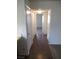 Hallway with neutral flooring and access to various rooms in the home at 1341 Cinder Rock Dr # 101, Las Vegas, NV 89128