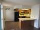 A well-equipped kitchen and dining area showcases wood cabinets and a modern appliance package at 1341 Cinder Rock Dr # 101, Las Vegas, NV 89128