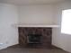 Close up of a stone fireplace with a white mantle in a cozy living room area at 1341 Cinder Rock Dr # 101, Las Vegas, NV 89128