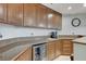 Modern bar area boasts granite counters, a wine fridge, and stylish seating, ideal for entertaining and relaxation at 15 Via Mantova # 308, Henderson, NV 89011
