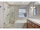 Elegant bathroom featuring a glass enclosed shower and tub at 15 Via Mantova # 308, Henderson, NV 89011