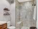Elegant bathroom showcasing a glass-enclosed shower with a built-in seat at 15 Via Mantova # 308, Henderson, NV 89011