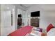 Bedroom with stylish bedding, TV, chest of drawers and mirrored closet at 15 Via Mantova # 308, Henderson, NV 89011