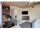 Cozy bedroom featuring neutral tones, a decorative ceiling, and a workstation with built in bookshelves at 15 Via Mantova # 308, Henderson, NV 89011