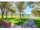 Community park featuring a lake with a fountain, trees, and sidewalks for enjoying the outdoors at 15 Via Mantova # 308, Henderson, NV 89011