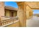 Mediterranean architecture featuring decorative columns, iron railings, and a stucco exterior under a blue sky at 15 Via Mantova # 308, Henderson, NV 89011