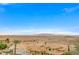 Elegant home exterior boasting a clay tile roof, desert landscaping, and scenic desert views at 15 Via Mantova # 308, Henderson, NV 89011