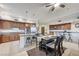 Spacious kitchen features stainless steel appliances, rich wood cabinetry, and a convenient center island with stool seating at 15 Via Mantova # 308, Henderson, NV 89011