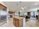 Expansive living area with a modern kitchen, cozy seating, and stylish decor, perfect for entertaining and relaxation at 15 Via Mantova # 308, Henderson, NV 89011